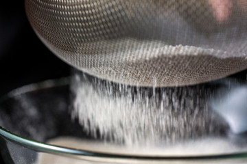 Sifting flour with sieve