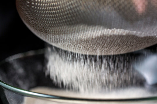 Sifting flour with sieve