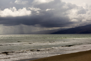 Pacific ocean during a storm. Beach landscape in the U.S. in bad weather. The ocean and waves during strong winds in United States, Santa Monica.