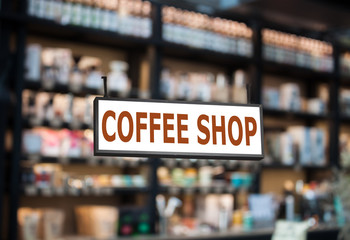 Coffee shop signboard with cafe blurred background