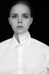 Girl in white shirt on black background. Professional model beauty - 113190302