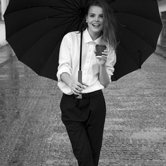 Student girl with coffee under umbrella. Black and white - 113190321
