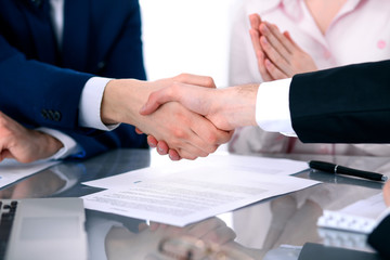 Business people shaking hands finishing up a meeting