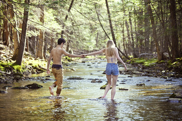 Couple walking in river