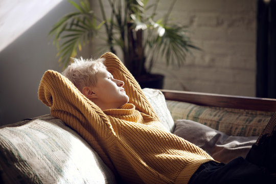 Young woman relaxing on sofa