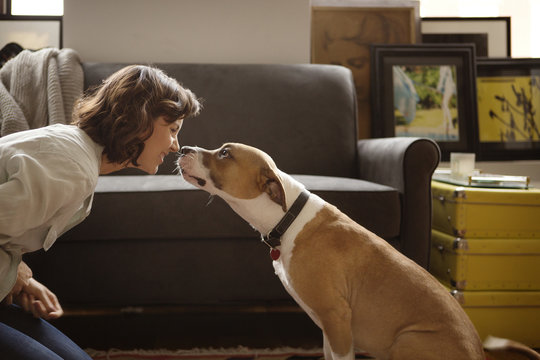 Woman playing with her dog