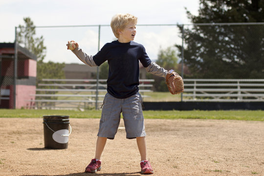 Boy playing baseball on field