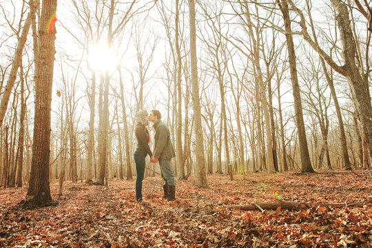 Couple kissing in forest