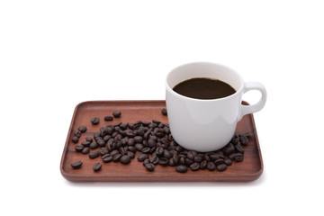 Coffee cup and beans on wooden tray isolate on white background