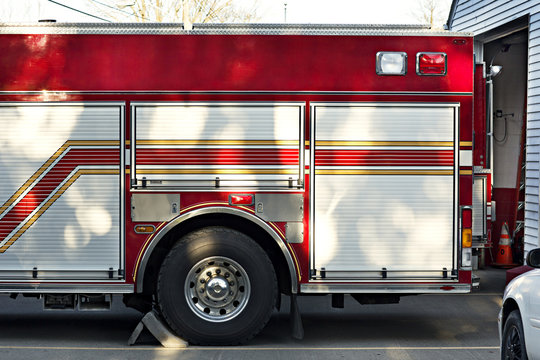 Cropped image of fire engine outside fire station