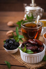 Mix dried fruits (date palm fruits, prunes, dried apricots, raisins) and nuts, and traditional Arabic tea. Ramadan (Ramazan) food.
