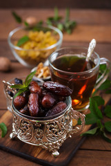 Mix dried fruits (date palm fruits, prunes, dried apricots, raisins) and nuts, and traditional Arabic tea. Ramadan (Ramazan) food.