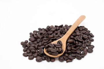 Wooden spoon and coffee beans isolate on white background