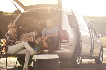 Young people camping by car