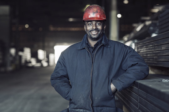 Portrait of worker standing in factory