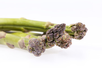 heap of green asparagus  vegetables isolated on white background