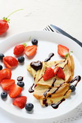 hot crepes with berries