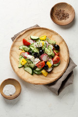 healthylifestyle greek salad on wood plate