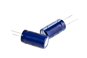 Two electrolytic capacitor in blue isolated on white - obrazy, fototapety, plakaty