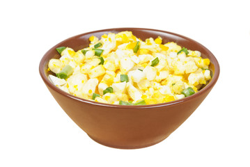 Salad with egg,green onion,cheese on brown bowl isolated on white