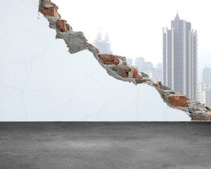 White crack bricks wall with city building background and concre
