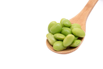 Soybean on wooden spoon isolated on white background