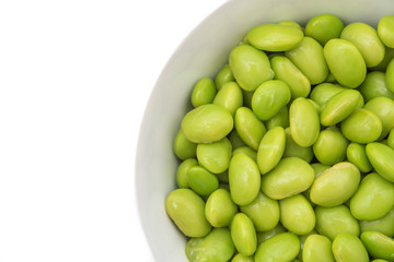 Soybean in the cup isolate on white background