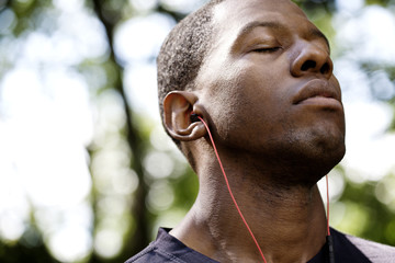 Close-up of man with eyes closed listening music