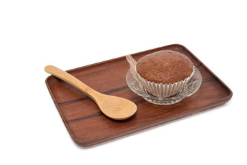 Banana muffin cake on wooden tray isolated on white background