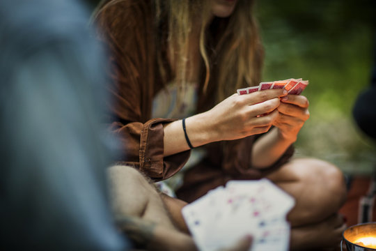 Woman playing cards outdoors