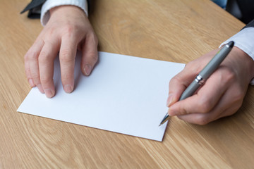 Obraz premium businessman writing on white paper