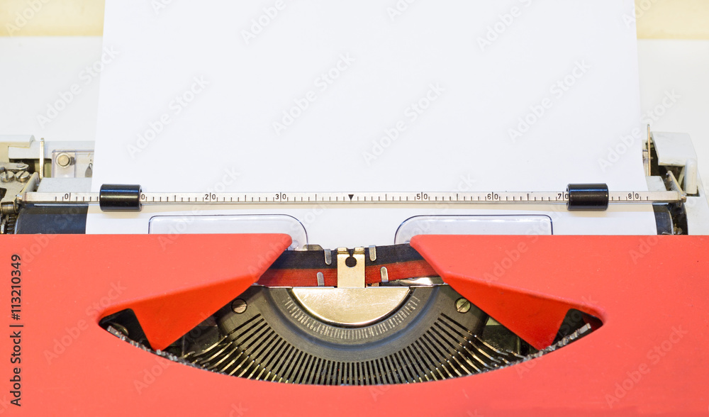 Fototapete close up image of red typewriter with paper sheet. copy space for your text.