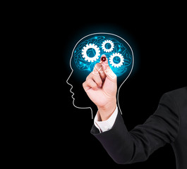 Businessman hand writing and drawing brain on a touch screen interface