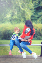 Summer time in the city park... A mother and daughter