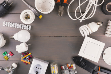 top view of electrical tools and equipment on wooden table