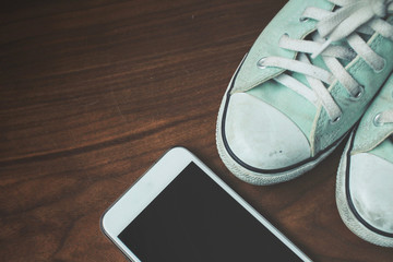 Selfie of smart phone with sneakers