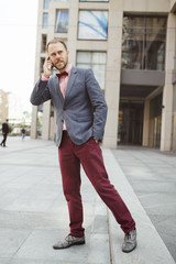 Stylish businessman walking in city