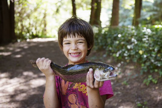 Boy holding fish