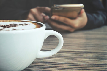 Woman drink coffee with smart phone