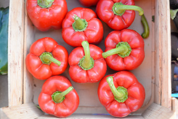 Group of fresh red peppers in a supermarket