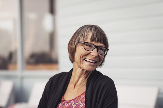 Smiling senior woman standing outdoors