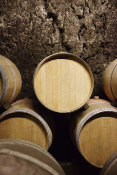 Close-up of barrels against wall
