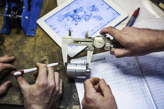 Worker measuring part with a dial caliper