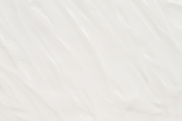 Cosmetics. Cream white background texture.