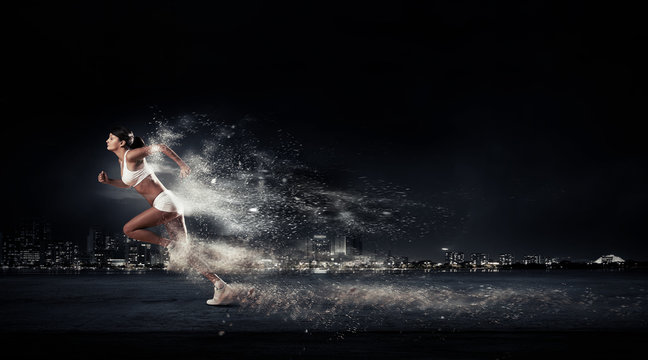 Athlete running fast © Sergey Nivens