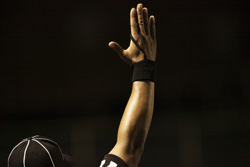 Football referee giving signal