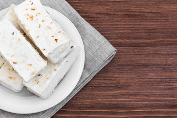 White pastry on wood background