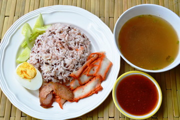 barbecued red pork in sauce with brown rice and soup