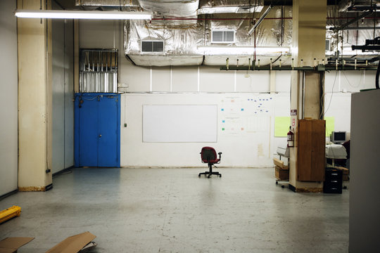 Office chair in empty storehouse