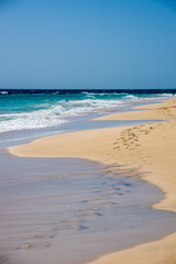 Atlantic Ocean waves and footsteps in sand in Sal, Cape Verde, Africa